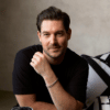 4 Craig Conover from Bravo's Southern Charm sitting at a table