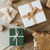 BLOG THUMBNAI_Anjali Three gift boxes on a table wrapped in holiday themed wapping paper