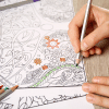 BLOG THUMBNAI_Anjali a person filling in a colouring book and using a green pencil