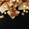 Gold gifts over black background