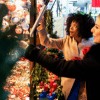 two women looking at Christmas decorations