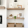 Brittany McNab Design Brittany McNab designed corner featuring photo frames, baskets and timeless design