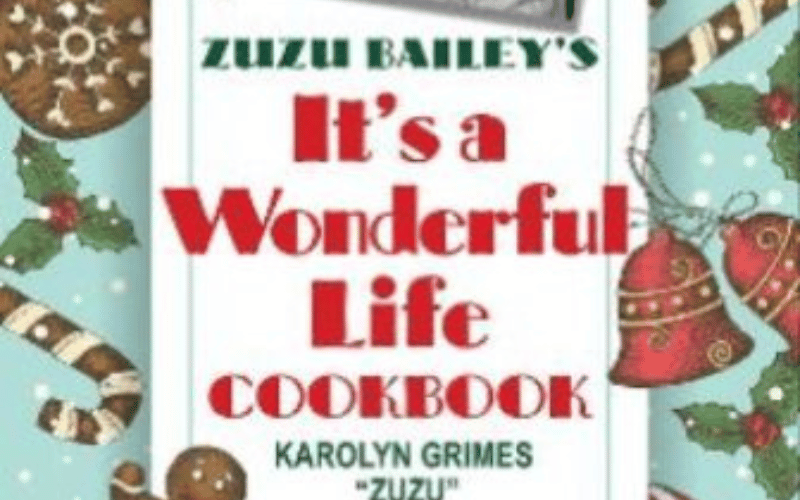 the cook image of a cook book with candy canes and gingerbread men on the front