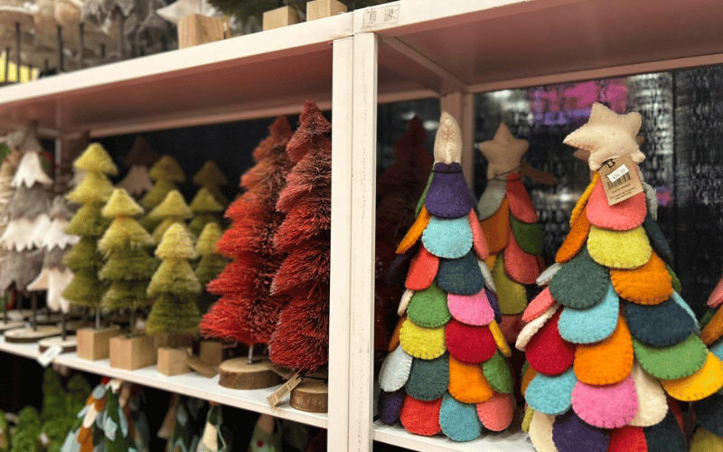 small colorful Christmas trees with cloth decorations