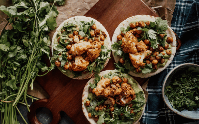 Cauliflower tacos over cilantro with chick peas