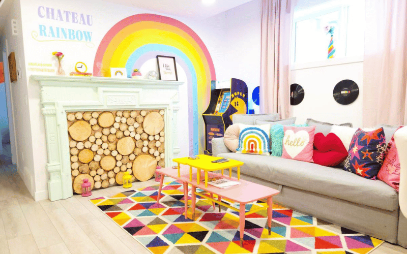 Chateau Rainbow room with bright colours and fake wooden patterns and bright geometric carpet