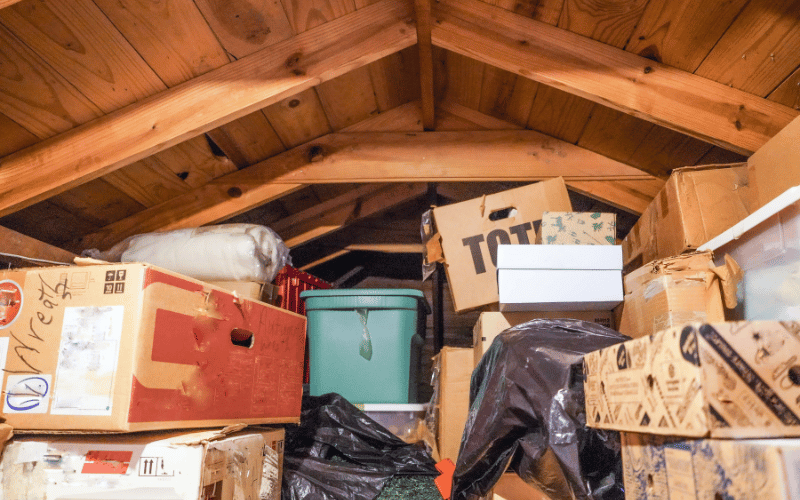 Storage boxes stacked high in a house attic