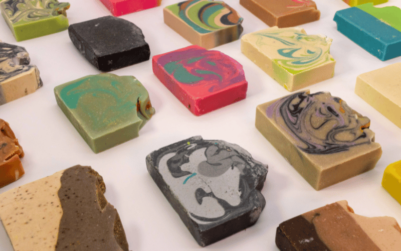 many colourful soaps placed on a table 